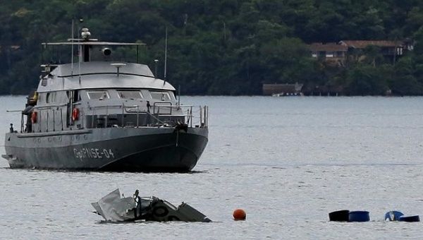 A Navy ship is seen near the wreckage from a plane, in Paraty, Rio de Janeiro state, Brazil, Jan. 20, 2017. 