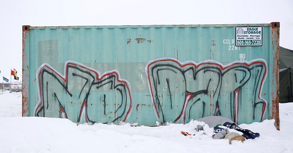Anti-Dakota Access Pipeline graffiti is seen in the protest camp on the edge of the Standing Rock Sioux Reservation near Cannon Ball.