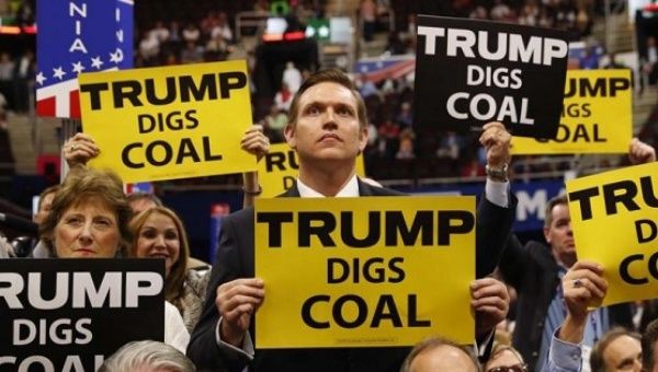 Delegates from West Virginia hold signs supporting coal on the second day of the Republican National Convention in Cleveland, Ohio.