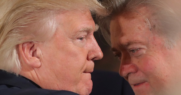 U.S. President Donald Trump talks to senior staff Steve Bannon during a swearing in ceremony for senior staff at the White House in Washington, DC Jan. 22, 2017.