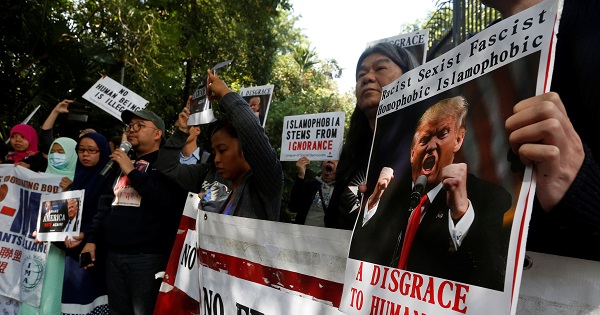 Protesters against the travel ban imposed by U.S. President Donald Trump's executive order gather outside the U.S. Consulate in Hong Kong.