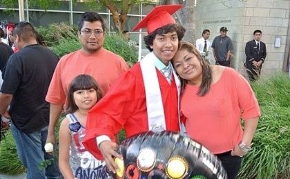 Miguel Molina at his high school graduation with his parents and sister. 