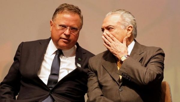 Brazil's interim President Michel Temer (R) talks with his Agriculture Minister Blairo Maggi during a Global Agribusiness Forum in Sao Paulo, Brazil July 4 2016.