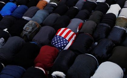 Demonstrators pray as they participate in a protest by the Yemeni community against President Donald Trump's travel ban in Brooklyn, New York, Feb. 2, 2017.