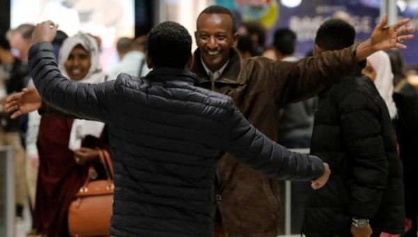 Faisal Etal, a Somali national is greeted by his brother Adan Etal at Washington Dulles International Airport after being delayed by U.S. travel ban, Feb. 6, 2017.