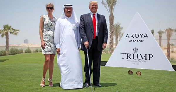 Donald Trump (R) and his daughter Ivanka pose with the chairman of DAMAC Properties Hussain Sajwani in Dubai, UAE.