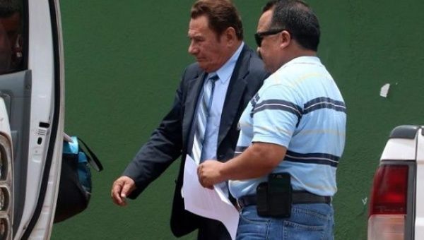 Jorge Perez Ardaya (R), the father of Bolivia's former interior minister, Jorge Perez Valenzuela arrives at the Interpol's headquarters in Santa Cruz, Bolivia.