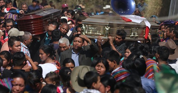 People attend the funeral of two murdered boys in San Juan Sacatepequez, Guatemala, Feb. 14, 2017.