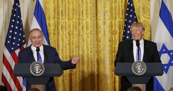 U.S. President Trump laughs with Israeli Prime Minister Netanyahu at a joint news conference at the White House in Washington.