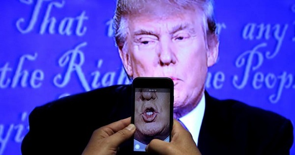 Donald Trump is recorded on a journalist's smartphone during his first presidential debate with rival candidate Hillary Clinton in New York, Sep. 26, 2016.