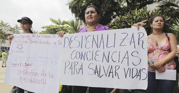 Women from feminist organizations protest El Salvador's abortion laws outside the Supreme Court in San Salvador, El Salvador, April 22, 2013.