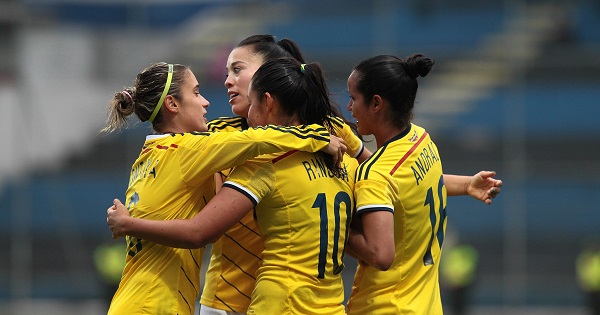 Players from Colombia celebrate after a goal during their match of the Women's America Cup at the Sangolqui stadium in the city of Quito, Ecuador, Sept. 26, 2014.