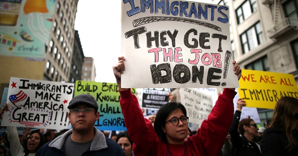 People participate in a protest march calling for human rights and dignity for immigrants, in Los Angeles, February 18, 2017.