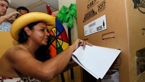 Diane Rodriguez, a member of the Ecuadorean transgender community, casts her vote during the presidential election in Guayaquil, Ecuador Feb. 19, 2017. 