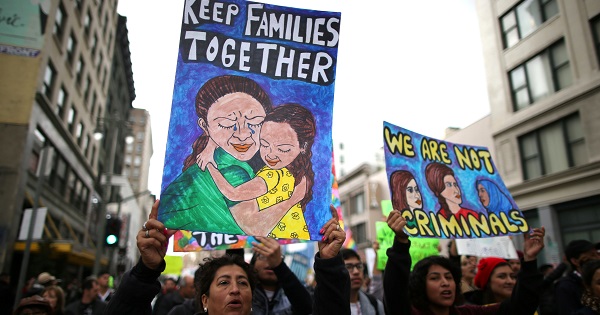 People participate in a protest march for immigrants in Los Angeles, February 18.