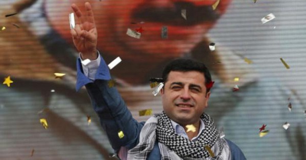 Selahattin Demirtas in front of an image of PKK leader Abdullah Ocalan
