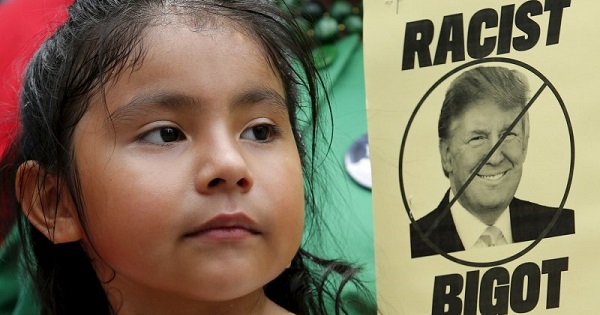 A girl participates in a protest in July calling for businesses to sever their relationships with Donald Trump over his then recent comments about Mexican immigrants.