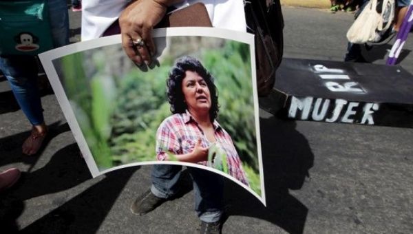 An activist holds a photos of slain environmental rights activist Berta Caceres during a march in Managua, Nicaragua, March 8, 2016. 
