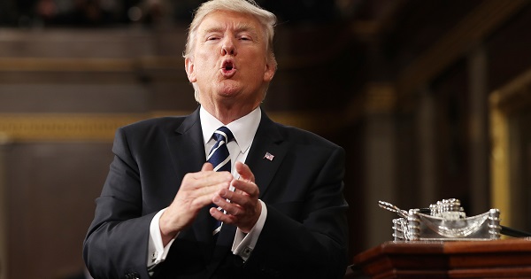 U.S. President Donald Trump reacts after delivering his first address to a joint session of Congress from the floor of the House of Representatives in Washington.