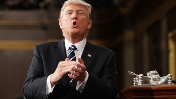U.S. President Donald Trump reacts after delivering his first address to a joint session of Congress from the floor of the House of Representatives in Washington.