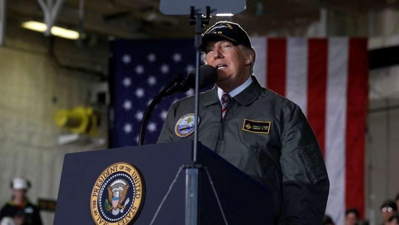 President Donald Trump delivers remarks aboard the U.S. Navy aircraft carrier Gerald R. Ford, where he pledged a massive U.S. military buildup.