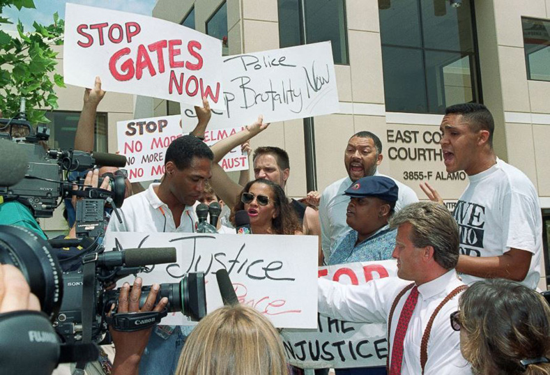Part of a group of about 100 protesters gather outside the East Ventura County Courthouse on May 5, 1992, in Simi Valley, California, to protest the verdict in the trial of the four police officers who were acquitted in the Rodney King case.