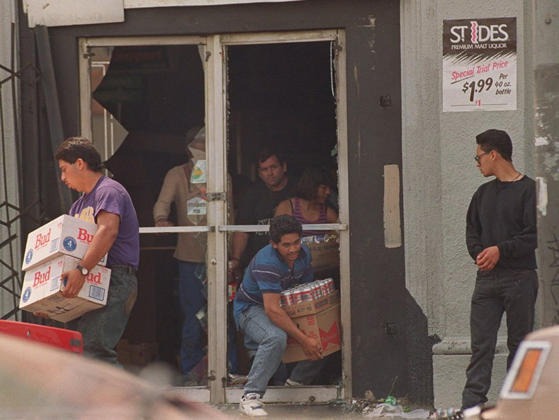Stay thirsty: a liquor store being raided on May 1, 1992, in Los Angeles.