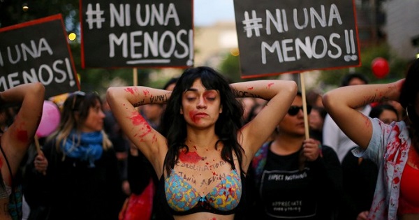 A demonstrator depicting lacerations is seen during a peaceful march against the gender violence in Santiago, Chile, Oct.19, 2016.