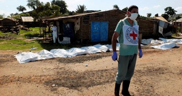 A worker from the International Committee of the Red Cross prepares to move bags containing bodies of unidentified people killed in the recent fighting in checkpoint area of Juba, South Sudan.