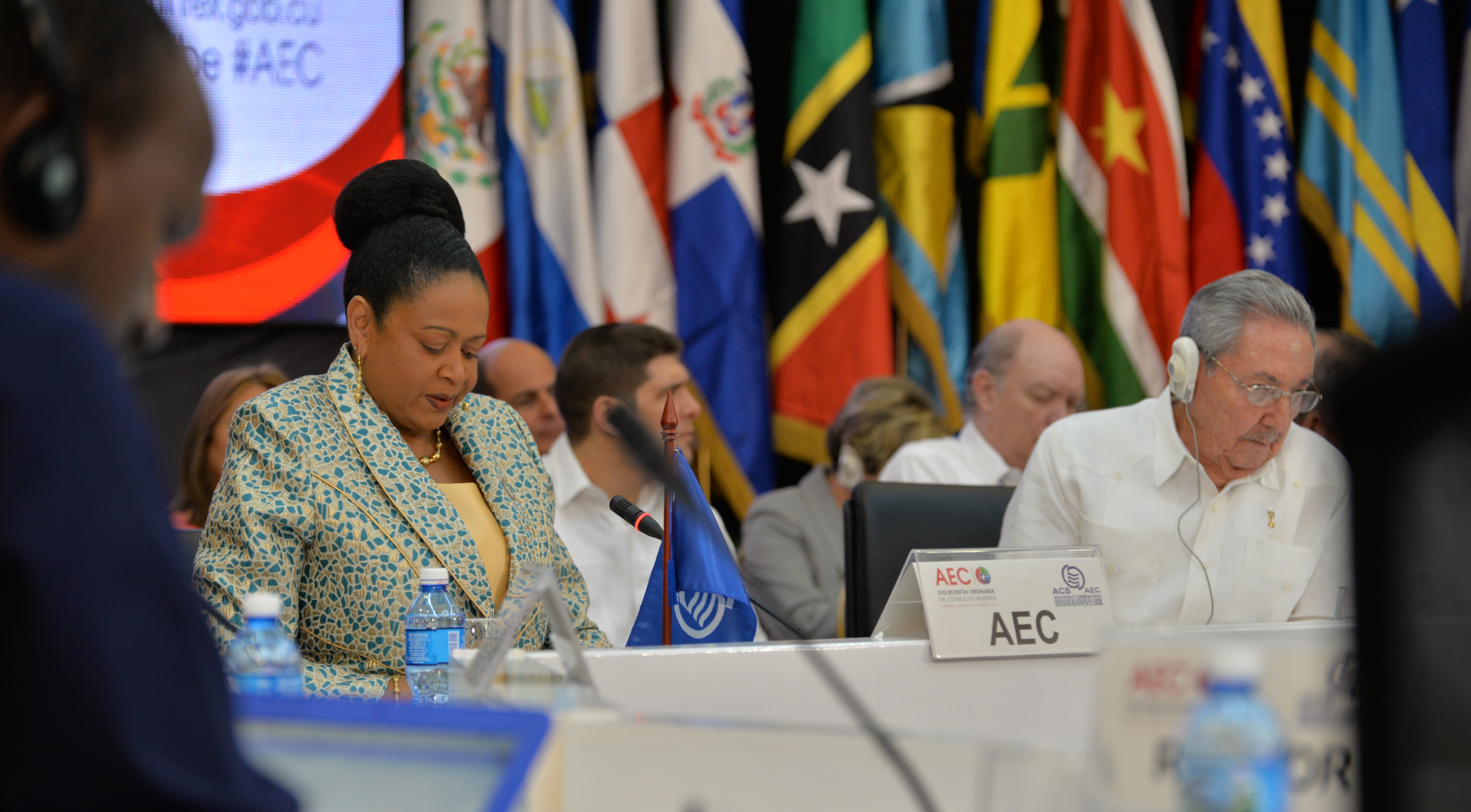 Newly-sworn in ACS Secretary General Dr. June Soomer sits next to Cuban President Raul Castro during her opening remarks at the 22nd Ordinary Meeting of the ACS.