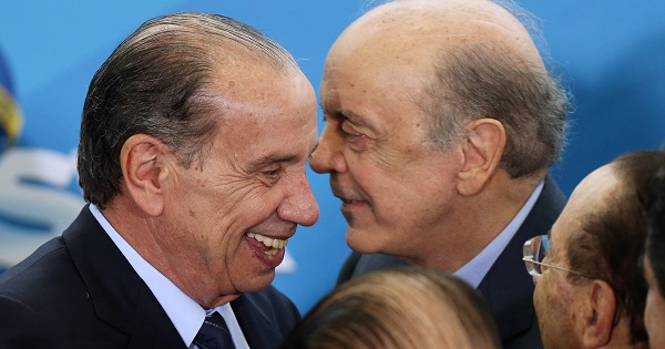 New Brazilian Foreign Minister Aloysio Nunes smiles to former Foreign Minister Jose Serra during the inauguration ceremony of the Ministers.
