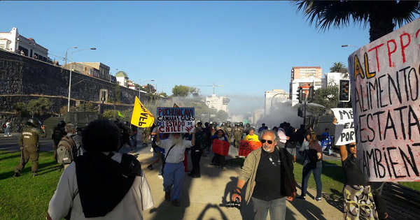 Police fire tear gas at TPP protesters in Chile.