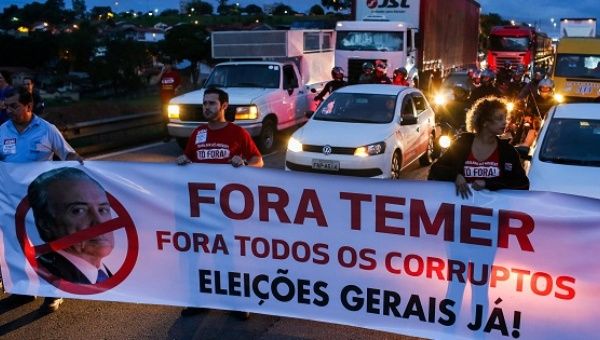 Protestors block the Presidente Dutra highway during a strike against Brazilian Social Welfare reform project from government, in Sao Jose dos Campos.