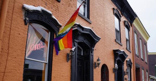 A rainbow flag hangs waves outside Edna's salon in Wheeling, West Virginia, U.S., Feb. 9, 2017.