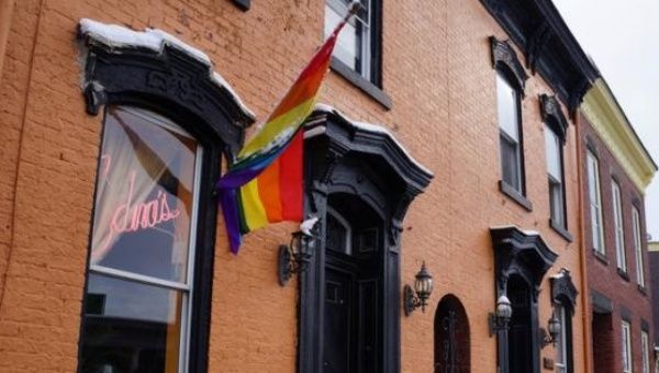 A rainbow flag hangs waves outside Edna's salon in Wheeling, West Virginia, U.S., Feb. 9, 2017. 