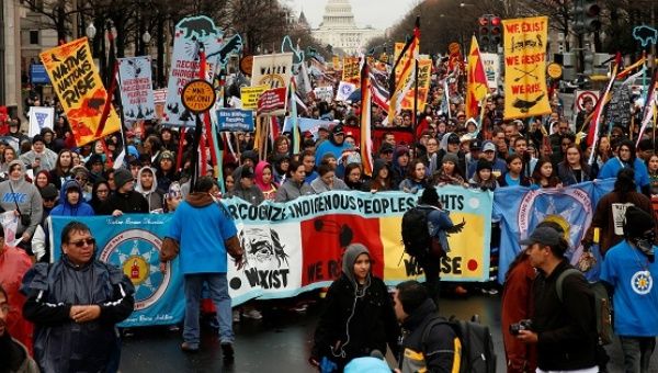 Indigenous leaders participate in a protest march and rally in opposition to the Dakota Access and Keystone XL pipelines. 