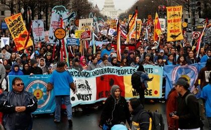 Indigenous leaders participate in a protest march and rally in opposition to the Dakota Access and Keystone XL pipelines. 