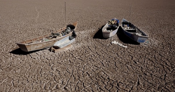 Fishing boats are shown on the dried Poopo lake bed in the Oruro Department, south of La Paz, Bolivia, on Dec. 17, 2015.