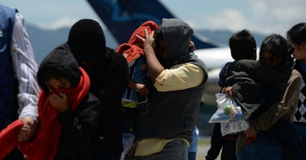 A group of women and children arrive in Guatemala after being deported from the United States in 2014.