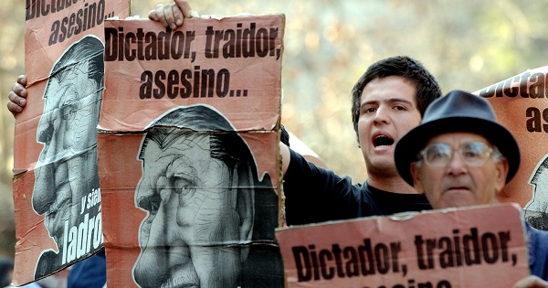 Archive photo of anti-Pinochet protesters during a march outside of the country's Supreme Court in Santiago de Chile..