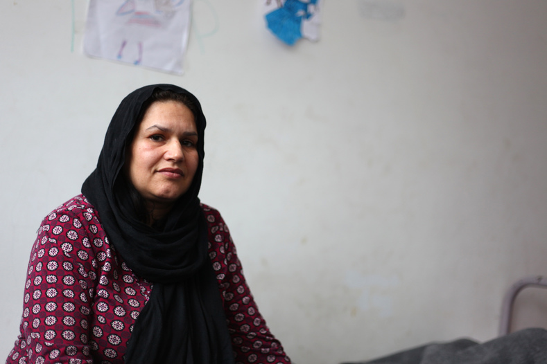 Peykey Naseri, an Afghan migrant poses for a photo in a refugee center with her five children in Adasevci, Serbia. 