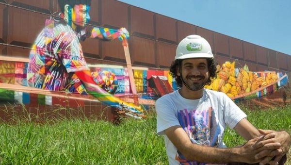 Famed Brazilian graffiti artist Eduardo Kobra poses in front of his mural in Sao Paulo, set to be the world's largest, March 31, 2017.