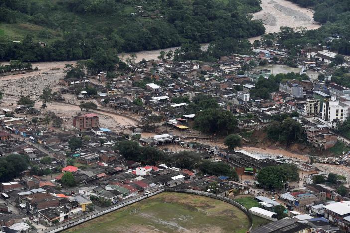 An aerial view shows a flooded area after heavy rains caused several rivers to overflow, pushing sediment and rocks into buildings in Mocoa, April 1, 2017.