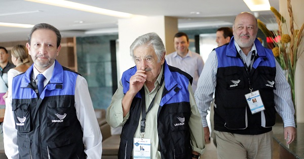 Uruguay's former President Jose Mujica (C) arrives with delegates of the Union of South American Nations, UNASUR.