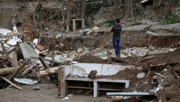 A man looks at a destroyed area after flooding and mudslides caused by heavy rains in Mocoa, Colombia April 2, 2017.