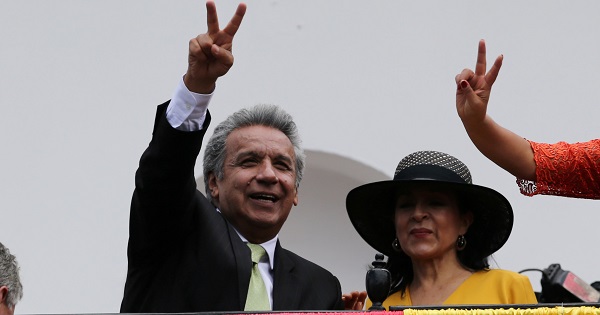 Ecuador's Presidential candidate Lenin Moreno stands next to his wife Rocio Gonzalez as he greets supporters from the government palace's balcony in Quito.