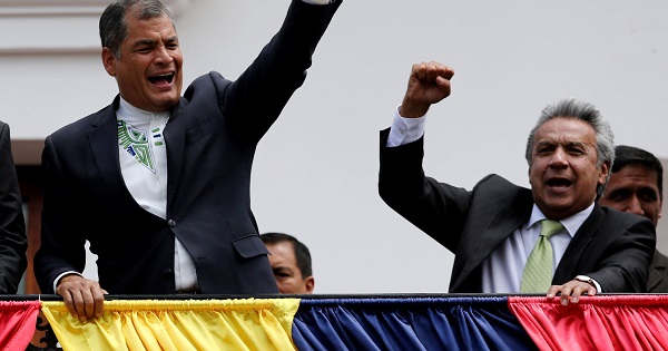 Ecuador's President Rafael Correa and president-elect Lenin Moreno greet supporters from the government palace's balcony during a change of guard ceremony in Quito.