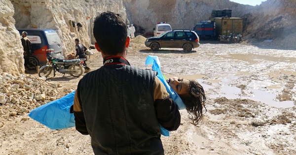 A man carries the body of a dead child, after what rescue workers described as a suspected gas attack near rebel-held Idlib, Syria April 4, 2017.
