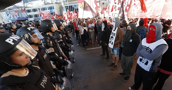 Police and protesters face off in Buenos Aires during a national general strike against the government's neoliberal policies, April 6, 2017.