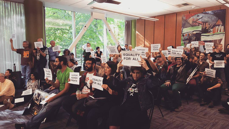 Portland State University students and community members show support for a divestment resolution, May 2016.